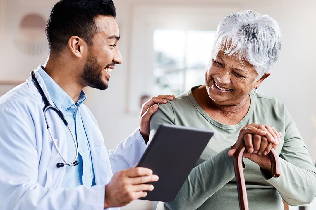 A clinician reviewing information with an older patient